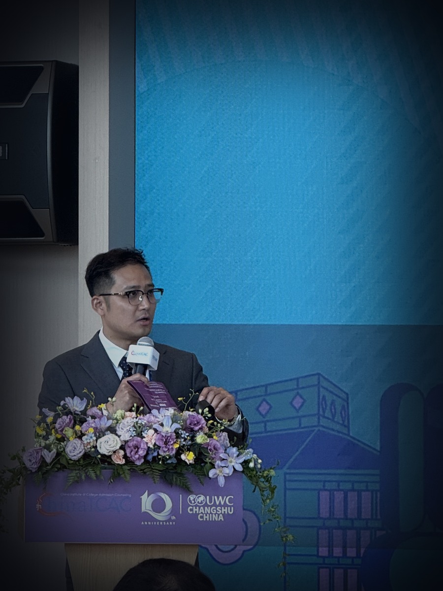 Joshua Ding speaking at an event