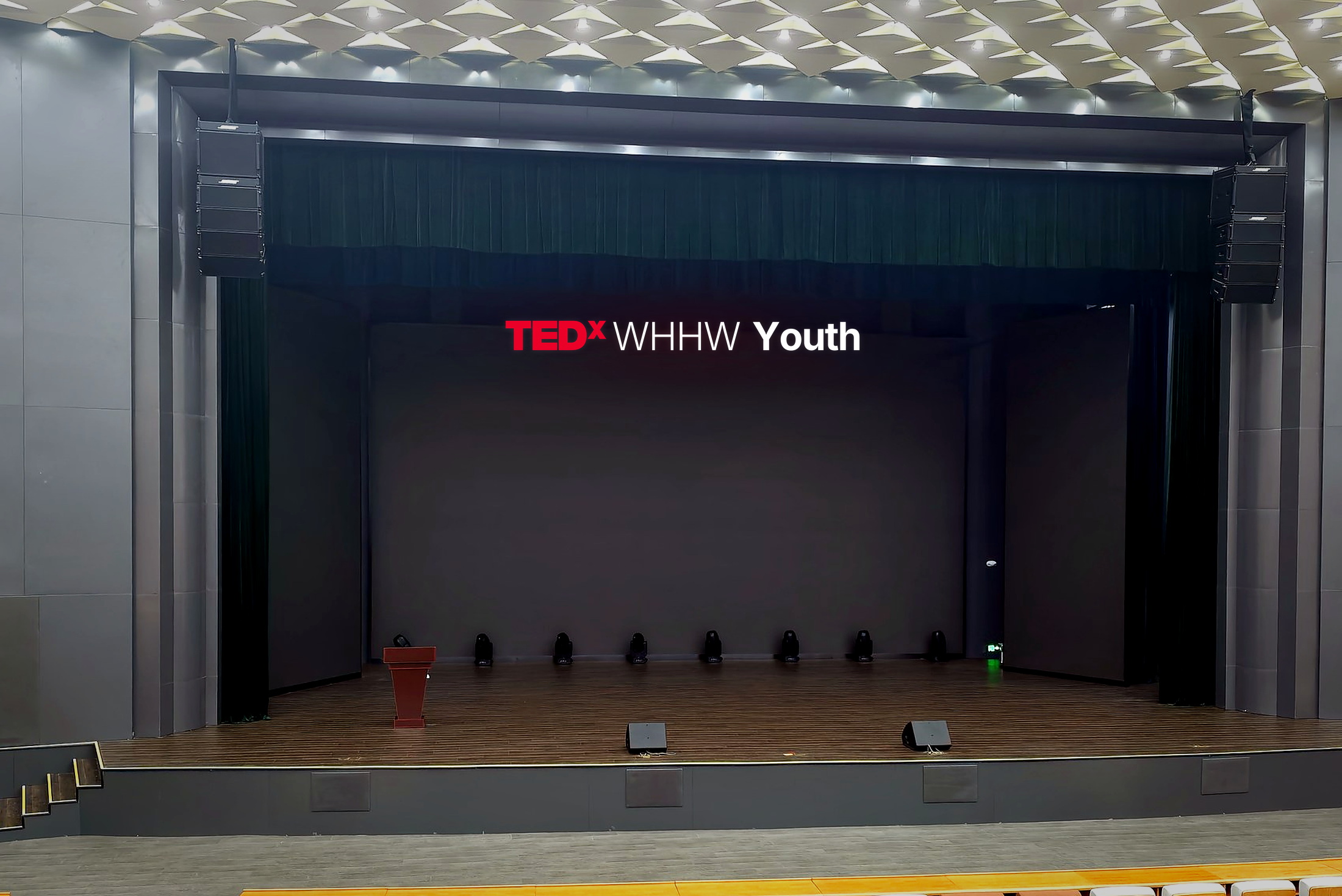 Angled side view of the auditorium seating and stage