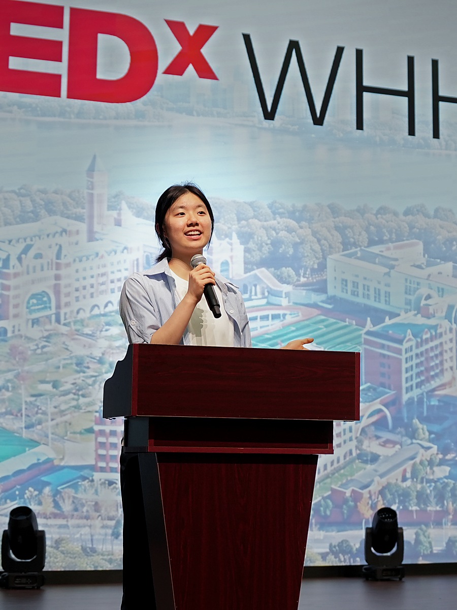 Barbara Wang speaking on the TEDxWHHW Youth stage
