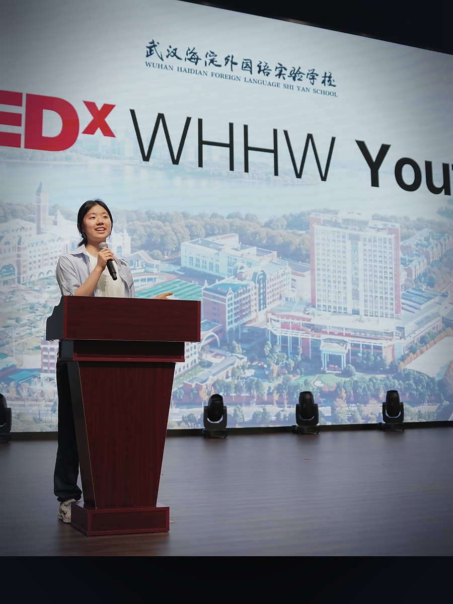 Barbara Wang speaking on the TEDxWHHW Youth stage